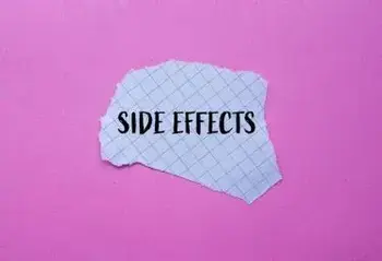 Side effects words written on ripped white graph paper with pink background. Conceptual side effects symbol. Copy space.: saxenda lawsuit