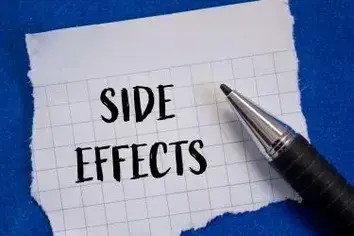 Side effects words written on ripped white paper with blue background. Conceptual side effects symbol. Copy space.: trulicity lawsuit